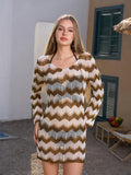 Woman wearing a long-sleeved, chevron-patterned knit cover-up dress