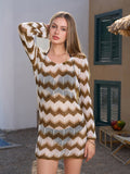 Woman posing with her hand on her head, wearing a chevron knit cover-up dress