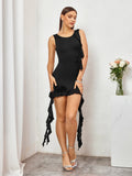 Woman posing in a black sleeveless bodycon mini dress with ruffle trim and rose accents.