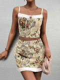 Woman wearing a yellow floral brocade cropped camisole with white trim and tie front.