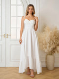 Woman wearing a white sleeveless maxi dress with adjustable tie straps and a ruched bodice.