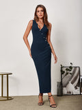 Full body shot of a woman in a navy blue sleeveless V-neck maxi sheath dress with button detailing and a side slit.