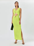 Woman in a sleeveless lime green maxi dress with a V-neck, twist front, cut-out detail, and high slit.