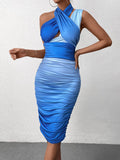 Woman wearing a blue ombre ruched bodycon dress with a criss-cross halter neckline