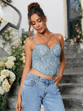 Front view of a woman posing in a blue lace corset top with a sweetheart neckline and intricate lace detailing.