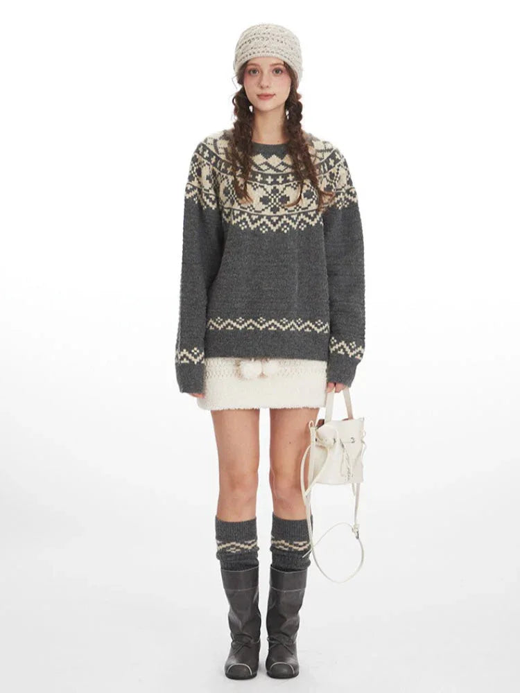 Woman wearing a grey Fair Isle crewneck sweater with a cream beanie and skirt Main image