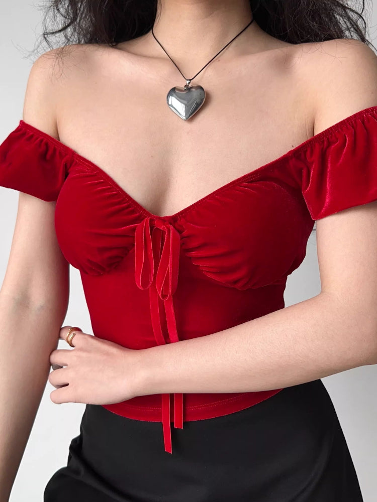 Red velvet top with tie front detail and puffed short sleeves