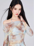 Close-up of the tie-dye print and neckline of the mesh top.