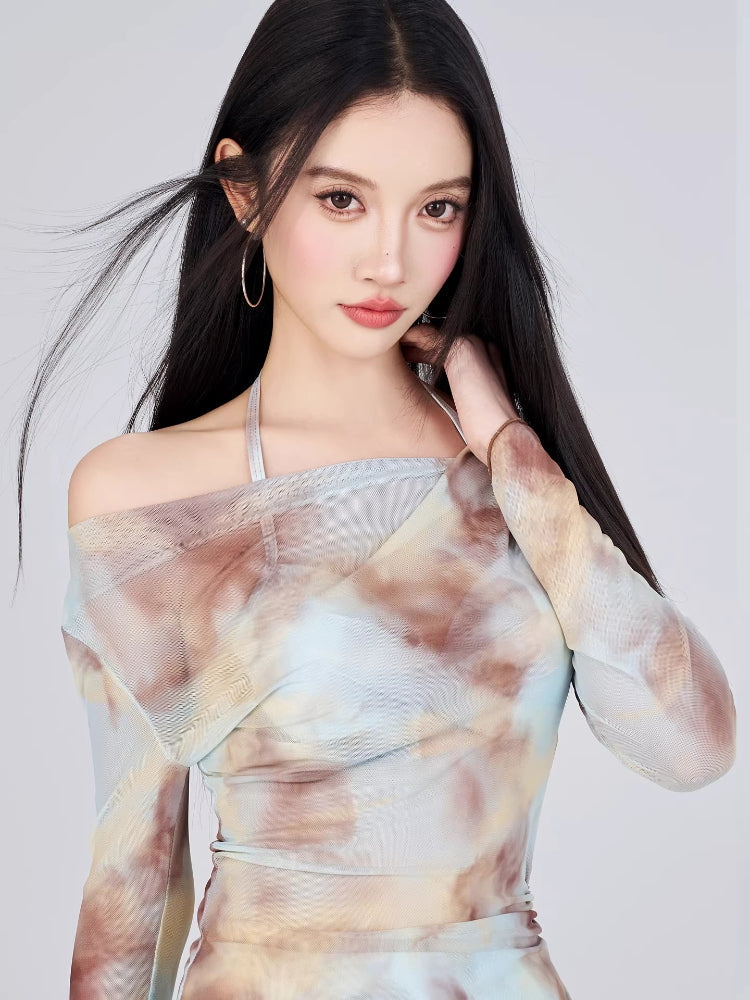 Close-up of the tie-dye print and neckline of the mesh top.