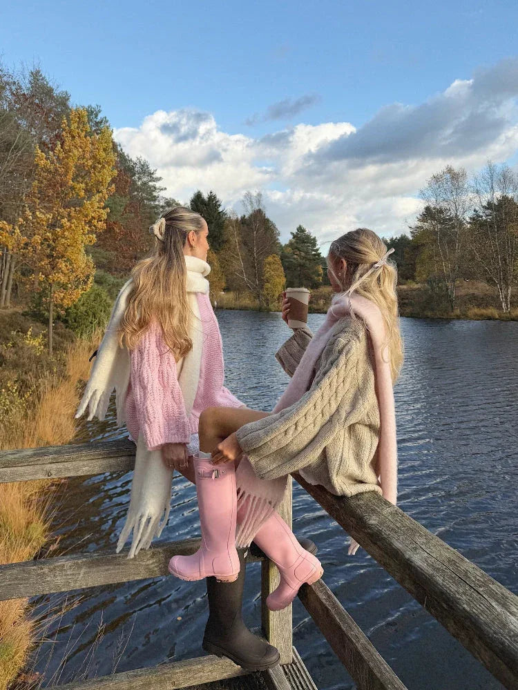 Woman wearing a pink chunky cable knit sweater - View 11 | WEUXS