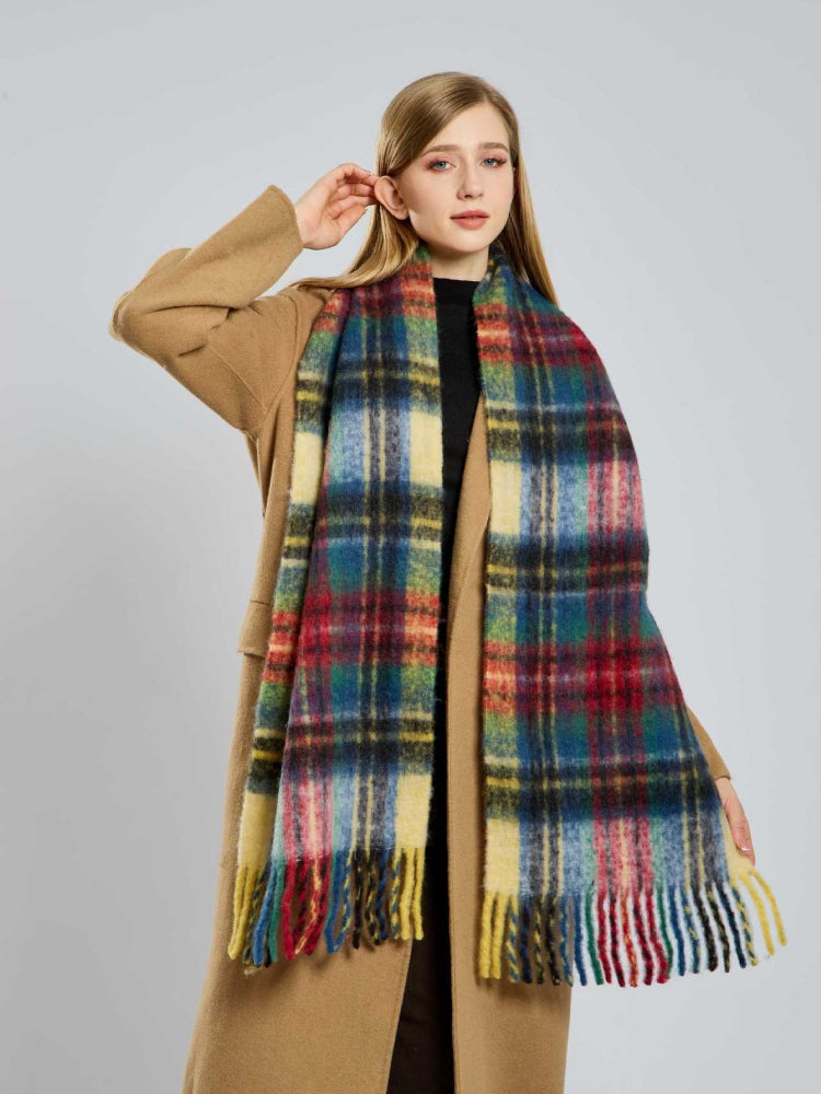 Close-up of a woman showcasing a vibrant plaid scarf