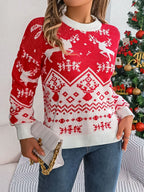 Woman holding a white clutch and wearing a red and white holiday sweater.