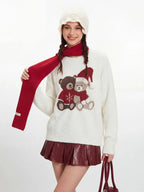 Side view of the oversized fuzzy knit teddy bear sweater