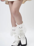 Legs of a person wearing white fuzzy character leg warmers and platform loafers