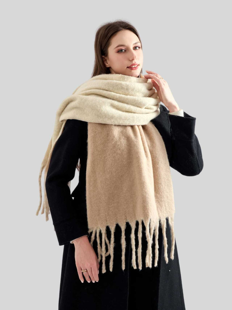 Close-up of a woman wearing a thick, soft beige scarf