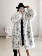 Woman modeling a long, spotted faux fur coat