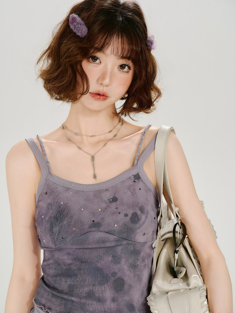 Woman with a handbag and a purple tie-dye camisole