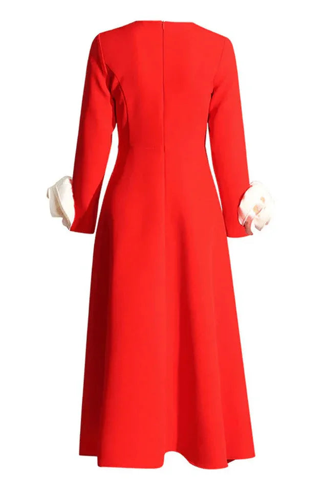 Back view of red long-sleeved dress with A-line skirt and rose cuffs