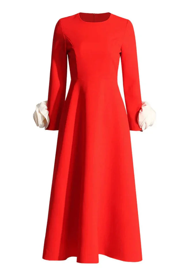 Full view of red long-sleeved dress with A-line skirt and rose cuffs