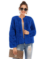 Woman wearing a royal blue faux fur jacket with an open front and textured sleeves.