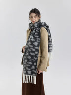Long scarf with tassel ends and animal print design