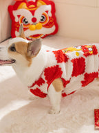 Corgi dog wearing a red and white checkerboard plush dog coat, side profile.
