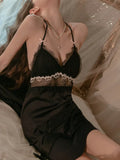 Back view of the black satin chemise with spaghetti straps