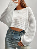 Close-up of the textured knit on a white cropped sweater