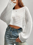 Close-up of the textured knit on a white cropped sweater