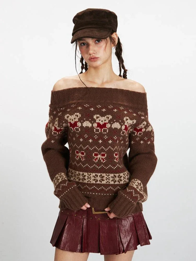Front view of a woman wearing a brown Fair Isle knit sweater with a bear and bow pattern, styled off the shoulder.