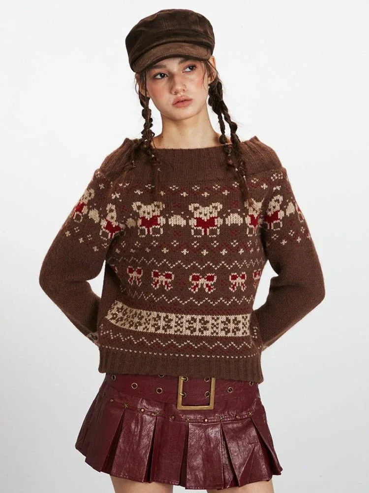 Close-up of a woman wearing a brown Fair Isle knit sweater with a bear and bow pattern, showcasing the neckline.