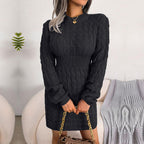 Woman wearing a black long-sleeve knit sweater dress with ribbed waistband