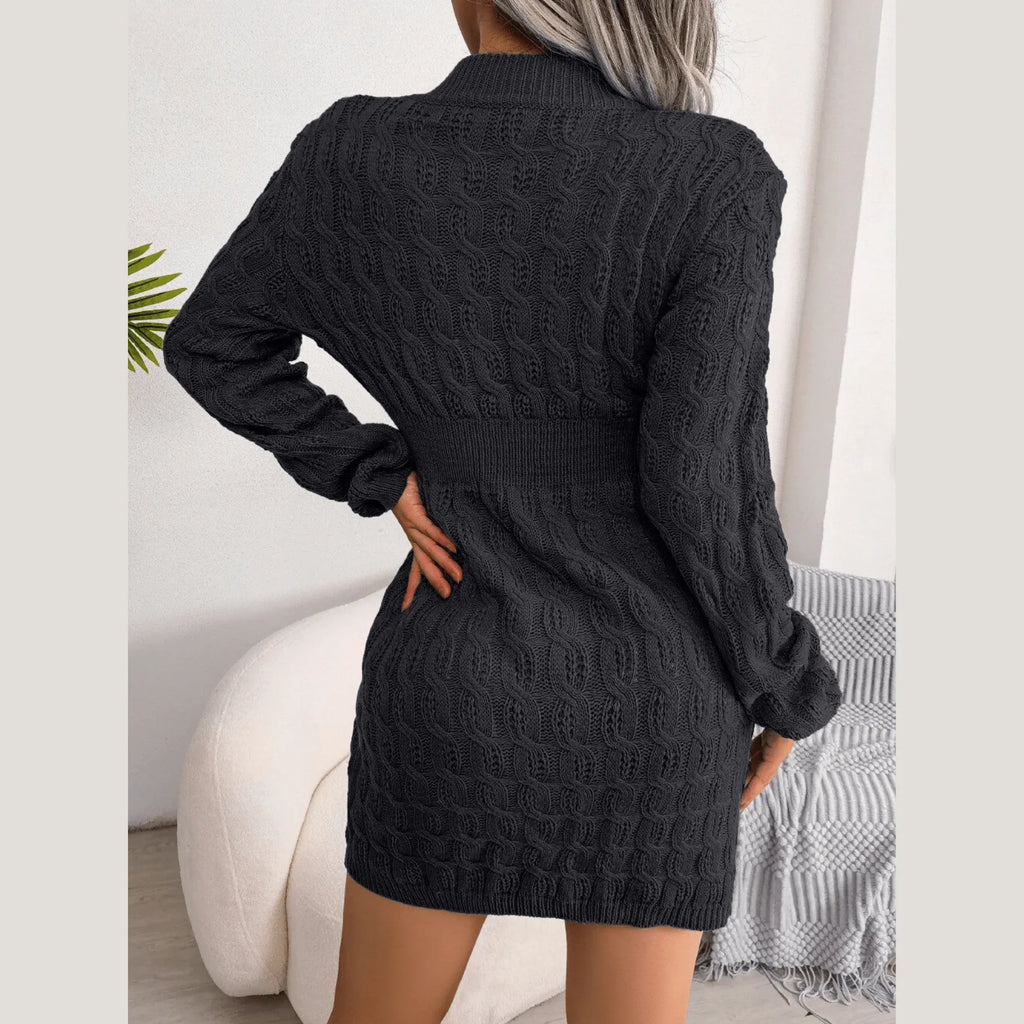 Back view of a woman in a black bodycon knit dress with cable knit pattern