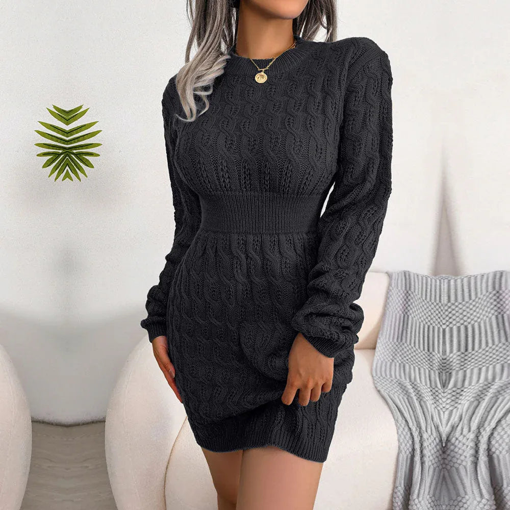 Woman wearing a blue long-sleeve knit sweater dress with a cut-out neckline