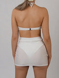 White ruched mini skirt with floral embellishment