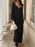 woman wearing a black long sleeve crochet maxi dress