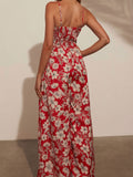 Back view of a woman in a red floral print wide-leg jumpsuit with a smocked bodice.
