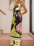 Side profile of a woman showcasing the wide-leg silhouette of a printed jumpsuit.