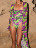 Woman from the side in a strapless floral print one-piece swimsuit.