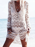 Cream crochet knit mini dress with long sleeves and V-neck