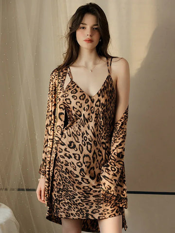 Woman wearing a leopard print satin slip dress and matching robe.