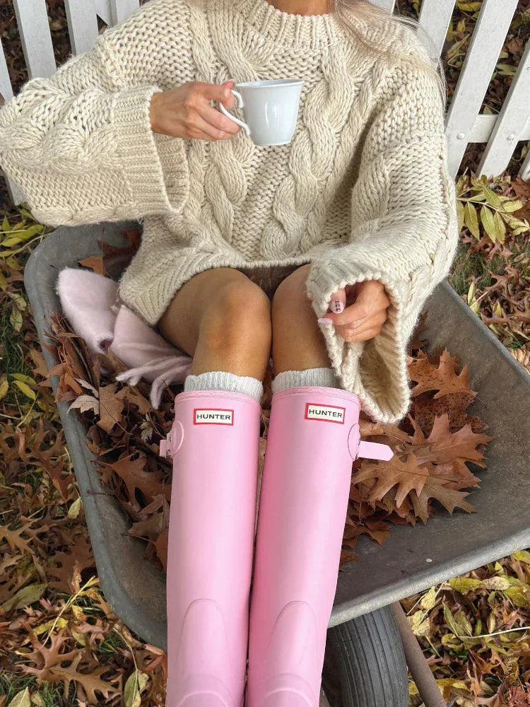 Woman wearing a pink chunky cable knit sweater - View 9 | WEUXS