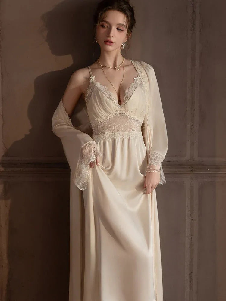 Full body shot of a woman in a cream satin slip dress and robe.