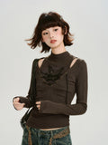 Model wearing a brown long-sleeve ribbed knit top with cut-out shoulders and a lace-up front detail.