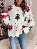 Woman in festive holiday knit sweater with snowflakes and Christmas trees.