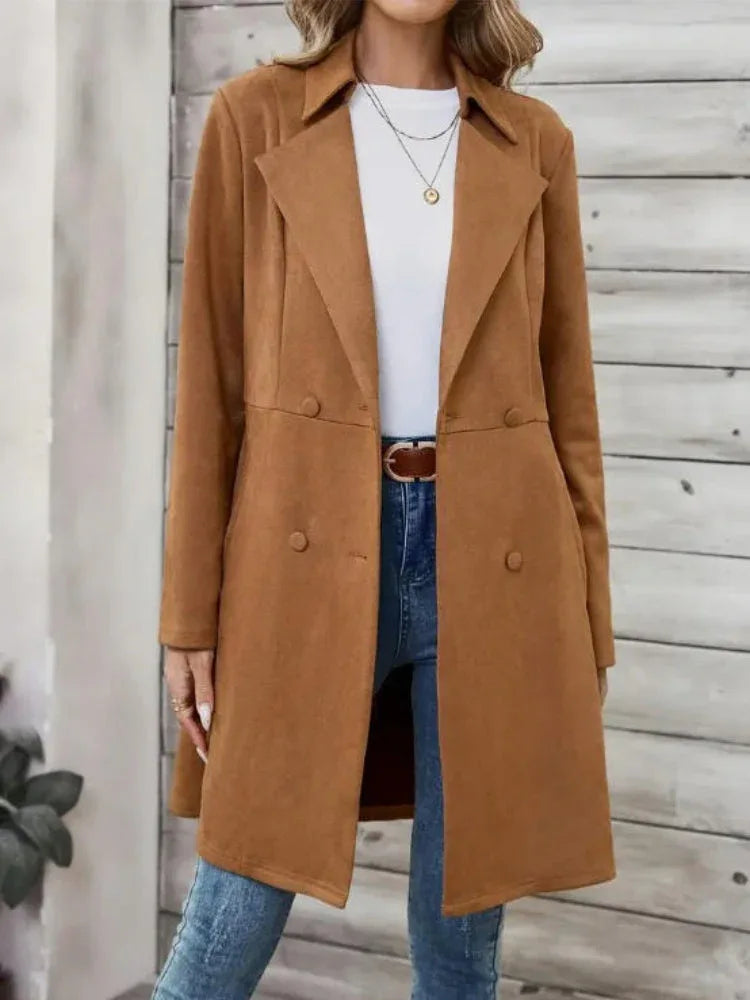 Woman wearing a brown suede-like longline coat with a notched lapel and double-breasted button closure. Main image