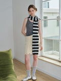 Woman in a striped scarf and skirt