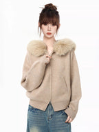 Close-up of the faux fur collar on a knit cardigan
