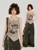 Full outfit view of a woman in a taupe ribbed knit graphic print tank top and dark wash cargo pants