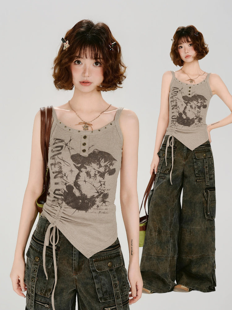 Full outfit view of a woman in a taupe ribbed knit graphic print tank top and dark wash cargo pants